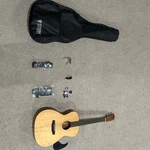 Open Offers Teton Guitar With 2 High End Straps And Capo Picks. Fixed Price $350.00.