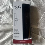 Taylor Guitar Wall Hanger Ebony. Fixed Price $44.99.
