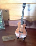 Taylor Swift Collectible- Miniature 9" Guitar From The Eras Tour- "presentation". Fixed Price $24.12.