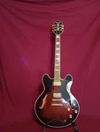 Vintage 1970S Epiphone Semi Hollow Electric Guitar Cherry Sunburst W/ Hard Case. Fixed Price $3150.00.