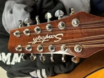 Sawtooth 12 String Guitar + Chromocast Hardshell Case. Fixed Price $350.00.