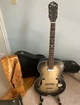 1960 Kay F Hole Archtop Guitar With Pickup And Old Hardshell Case. Fixed Price $299.00.