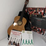 Acoustic Guitar - Starters With Cover Bag + Two Lessons Books. Fixed Price $99.99.