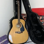 Yamaha Acoustic Guitar F310 With Black Road Runner Hard Case & Playing Strap. Fixed Price $196.00.